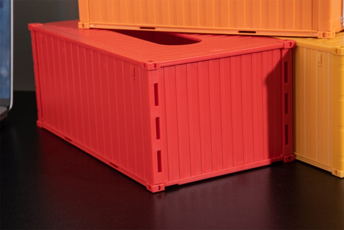 Porte-serviettes en forme de conteneur
